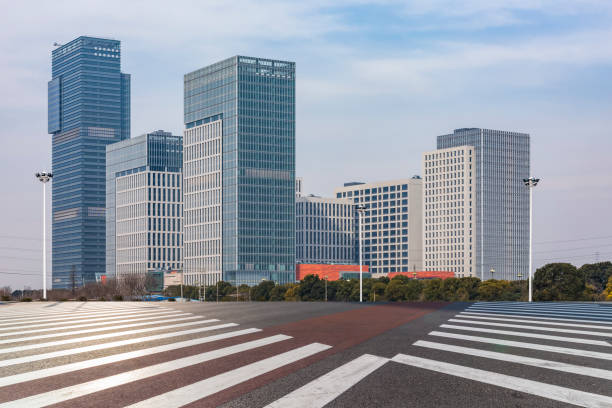 istock Panoramic skyline and modern business office buildings with empty road,empty concrete square floor 970958698