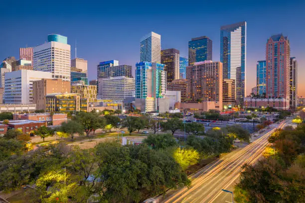 Houston, Texas, USA downtown park skyline at twilight.
