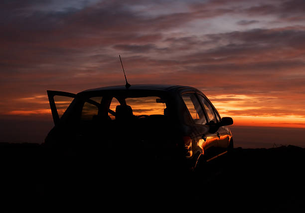 istock car and sunset in the background 97097463