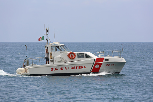 AMALFI COAST, ITALY - JUNE 28, 2014: Coast Guard Boat Patrolling at Tyrrhenian Sea in Amalfi Coast, Italy.