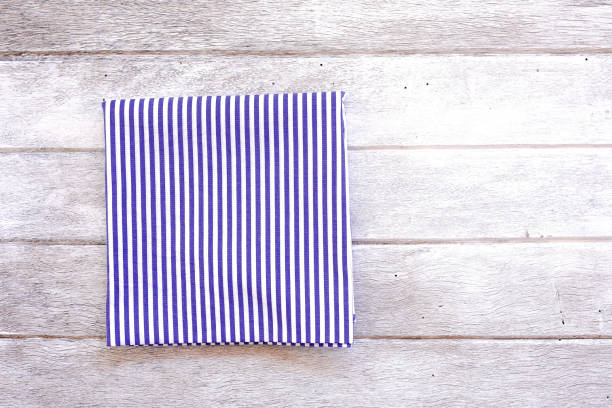 istock Blue Tablecloth On An Old Wooden Table. Top View. 970977490
