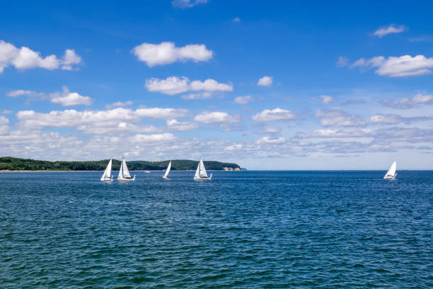 istock Blue sky, clouds, sea and sailing boats 970978510