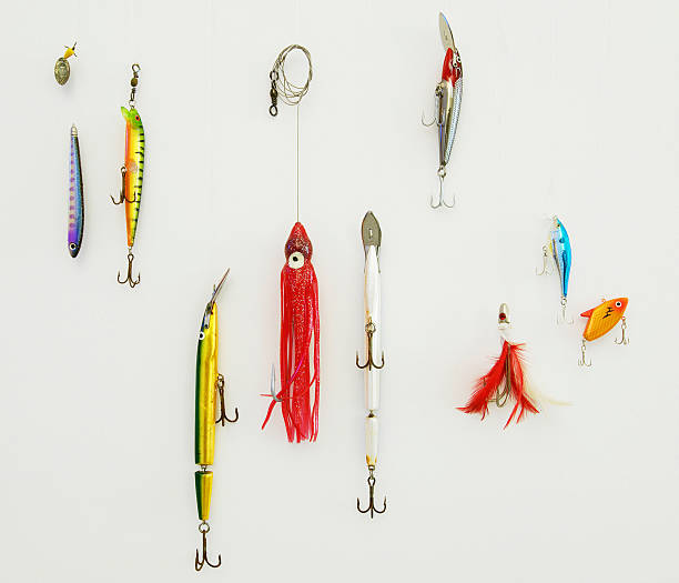 istock Different types of fishing lures on a white wall 97098254
