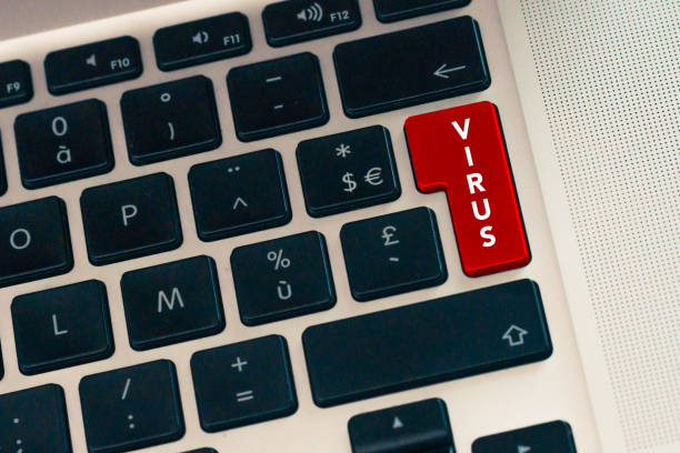 istock Close up of computer laptop keybord with red button. Virus danger concept. Internet data and cyber crime security 970991064