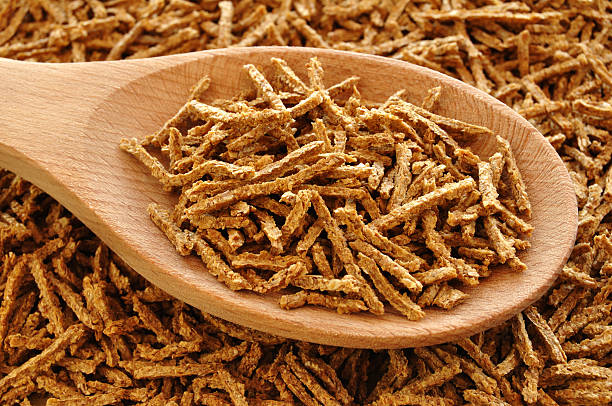 istock Wheat Bran Cereal on Wooden Spoon 97099316