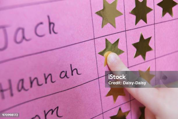 Close Up Of Child With Reward Chart Stock Photo - Download Image Now - Incentive, Child, Chart