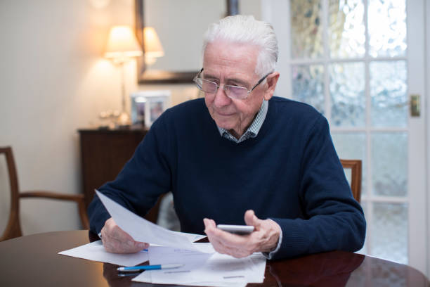 istock Concerned Senior Man Reviewing Domestic Finances 970998344
