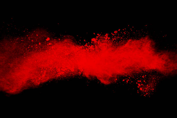 istock abstract red powder explosion on black background. abstract red dust splattered on background. Freeze motion of red powder splashing. 970998570