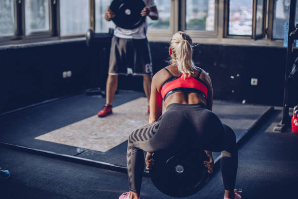 istock Women exercising in the gym 971001002