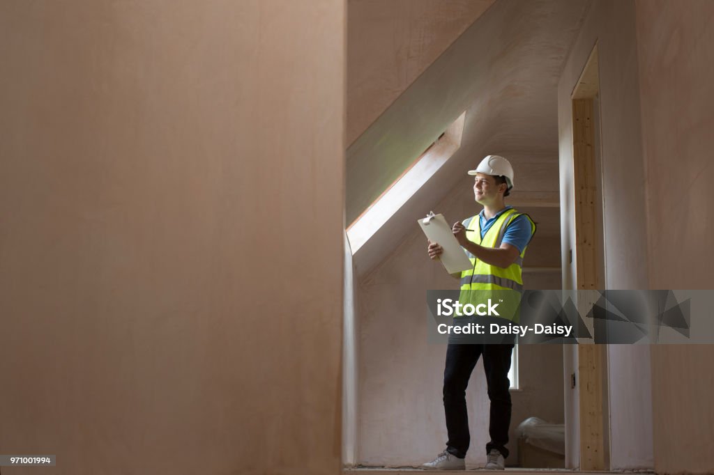 Inspector On Building Site With Clipboard Construction Industry Stock Photo