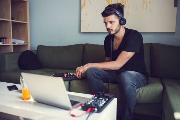 istock Young Man Creating music At Home 971004942