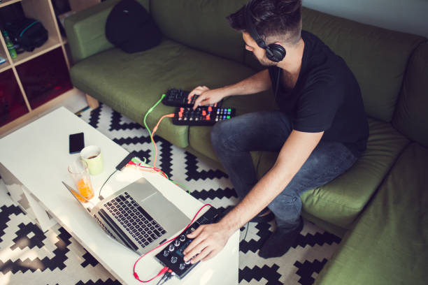 istock Busy Musician Producing Music From Home 971004964