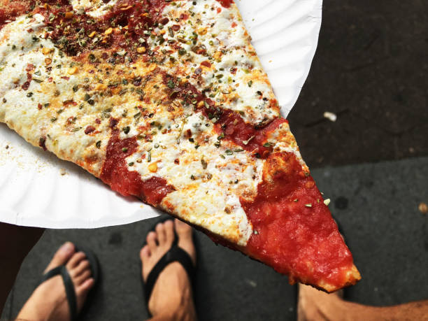 Fresh Pizza Slice on White Paper Plate