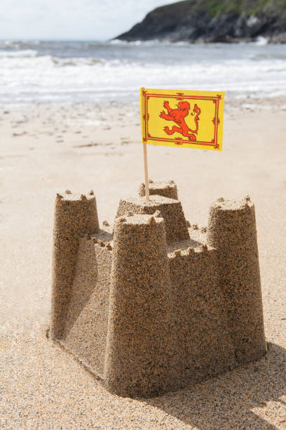 istock Sandcastle On Beach Flying Scottish Flag 971005536