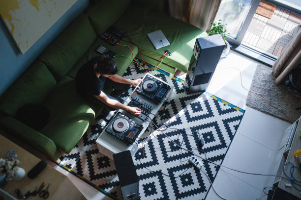 Young Man Playing Music At Home Party