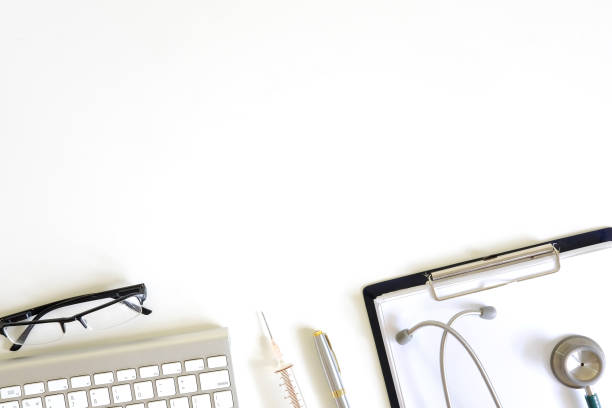istock Doctor workspace with Medical equipment on white table with top view. 971008790