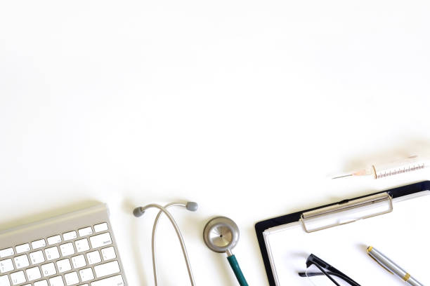 istock Doctor workspace with Medical equipment on white table with top view. 971008852