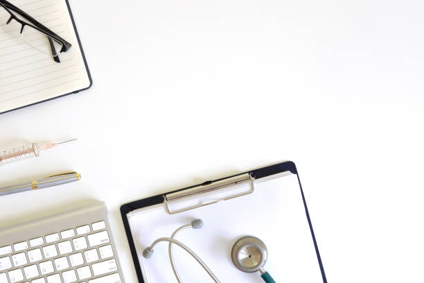 istock Doctor workspace with Medical equipment on white table with top view. 971009112