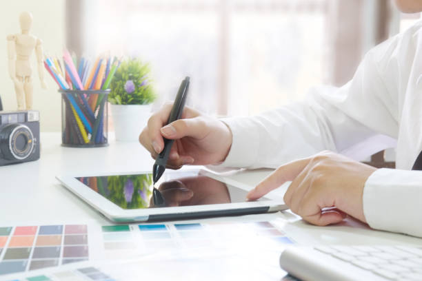 istock Graphic designer working with digital tablet cropped shot photo. 971011396