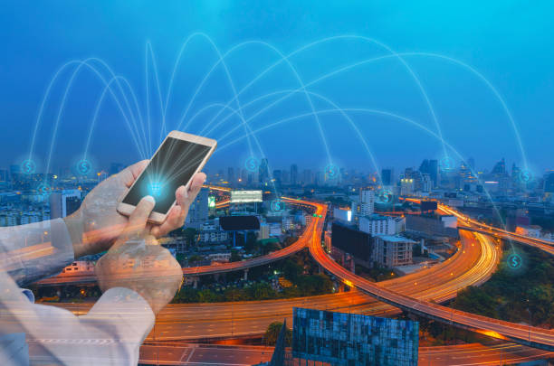 istock double exposure businessman using touching shopping cart button on mobile phone and link money point to city with technology communication connecting global network marketing online concept. 971011826