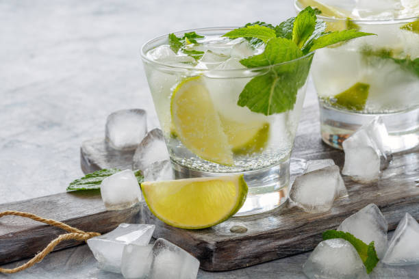 istock Drink of lime and mint with ice cubes. 971012650