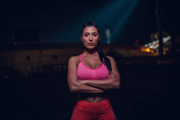 istock Young sporty woman at night 971015280