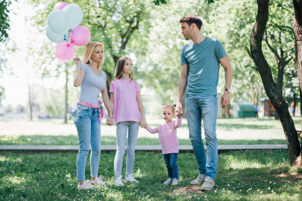 istock Happy young family holding hands 971022100