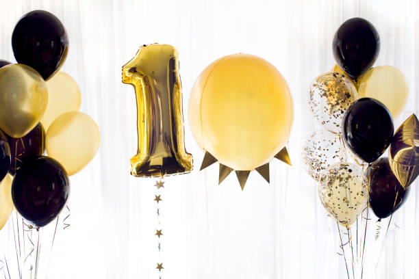 istock Yellow black helium balloons number ten 10 971025852