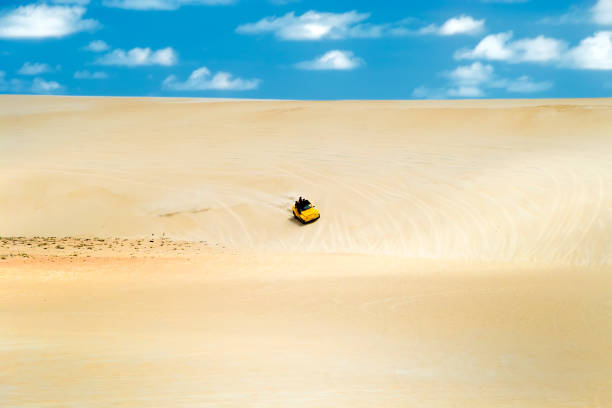 Dune Buggies,Natal.Brazil Beach-buggy with its tourist passengers races along the dunes at Genipabu near Natal, northeast Brazil natal brazil stock pictures, royalty-free photos & images