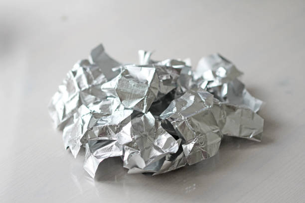 istock Foil. Metal crumpled background. Gray or silver background 971036366