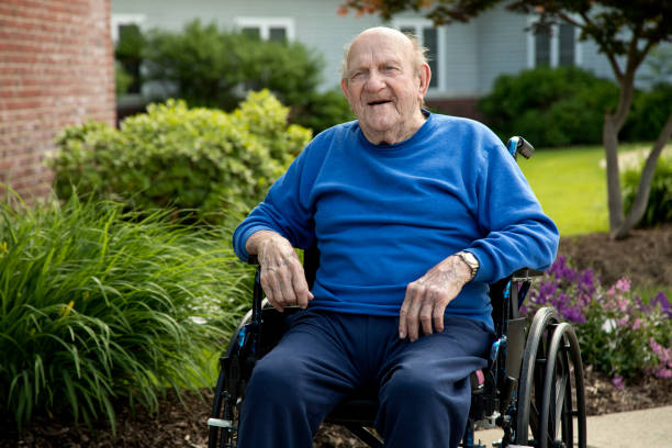 Elderly man in wheelchair sitting outside nursing home Handicapped senior with a pleasant look in wheelchair. Image shot with Canon 5D Mark lV, 24-105mm f/4L IS USM lens. over 100 stock pictures, royalty-free photos & images