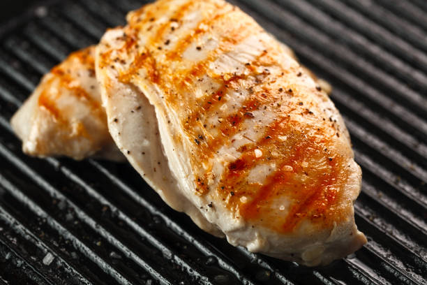 istock grilled chicken with spices on black background 971039660
