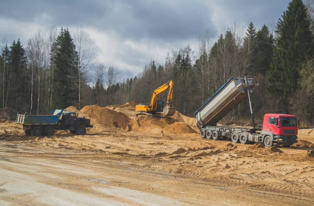istock Construction of new transport road through the forest. Beginning of work. 971043258