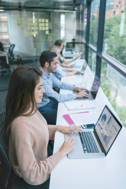 istock Group of people working at a co-working office 971043564