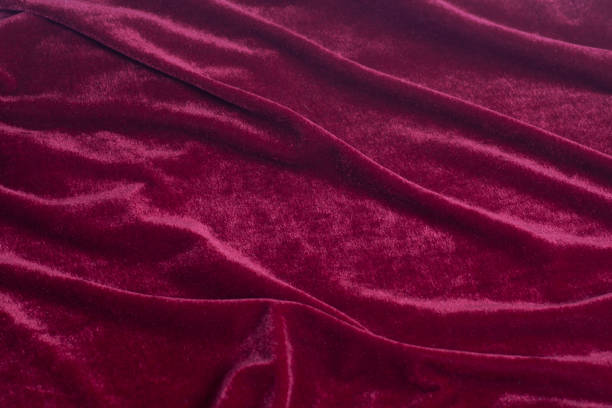 Red velvet fabric background texture Red velvet fabric background texture close up. red velvet material stock pictures, royalty-free photos & images