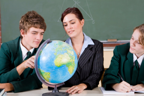 young female teacher near blackboard and start study. classroom