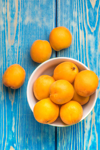 istock Bowl full of fresh apricots. 971054014