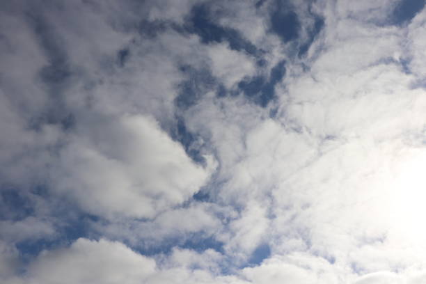 istock Close up of fluffy white clouds in blue sky, cloudscape 971054088