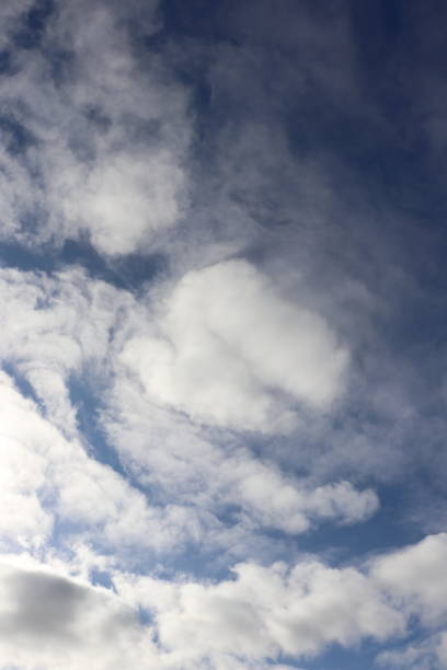 istock Close up of fluffy white clouds in blue sky, cloudscape 971054110