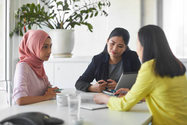 istock Professionals discussing in meeting at table 971056594