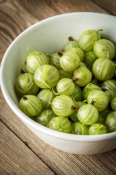 istock Fresh gooseberry in a white bowl. 971056624