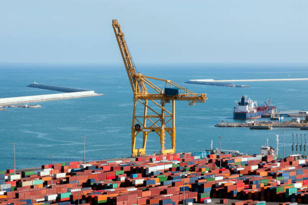 Large floating crane working on repairing a pier of Barcelona.