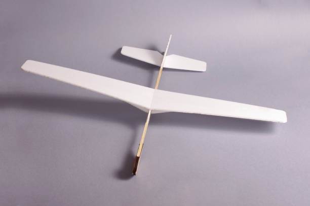 istock DIY foam board plane isolated on the gray background 971057538