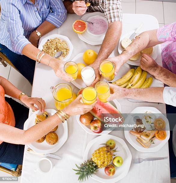 A Family Having Breakfast Together Stock Photo - Download Image Now - Breakfast, Family, Celebratory Toast