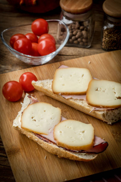 istock Sandwich with ham and smoked cheese. 971060368