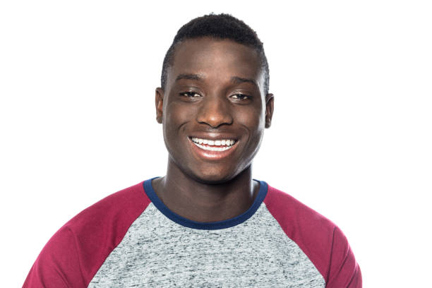 istock Smiling young man against white background 971067146