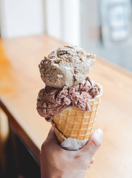 istock 2 ice cream scoops stacked on top of each other - handheld 971067404