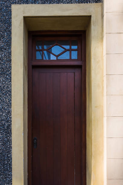 istock Modern doorway - wooden with stone wall 971067638