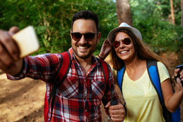 istock Couple hiking and taking selfies 971070978