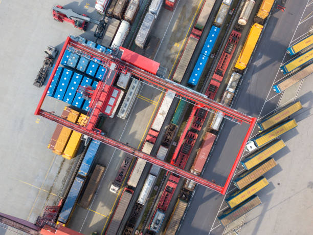 istock Cargo trains, trucks and a huge crane at freight terminal, Austria 971071044